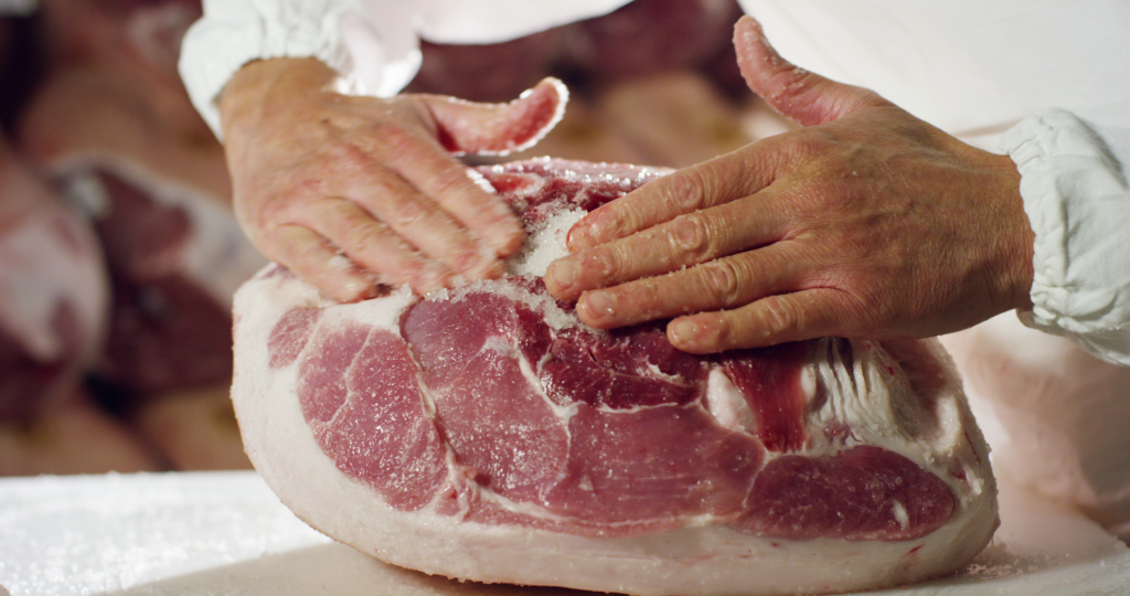 Curing ham using salt 