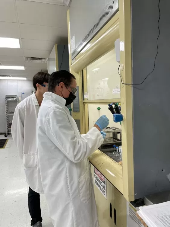 Technicians working in a food testing lab.