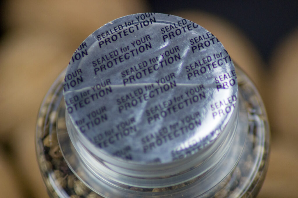 Tamper-resistant packaging on a bottle of spices. 